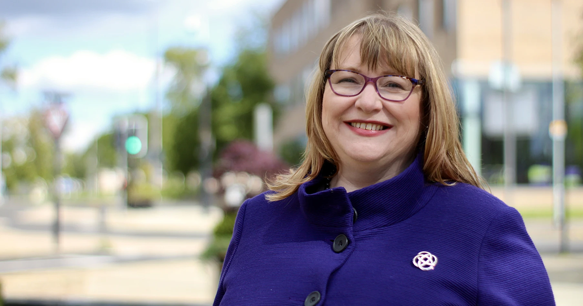 Clare Adamson MSP in front of the Houldsworth Centre, Kenilworth Avenue, Wishaw Clare Adamson MSP wearing a purple coat stands in front of the Houldsworth Centre on Kenilworth Avenue in Wishaw.